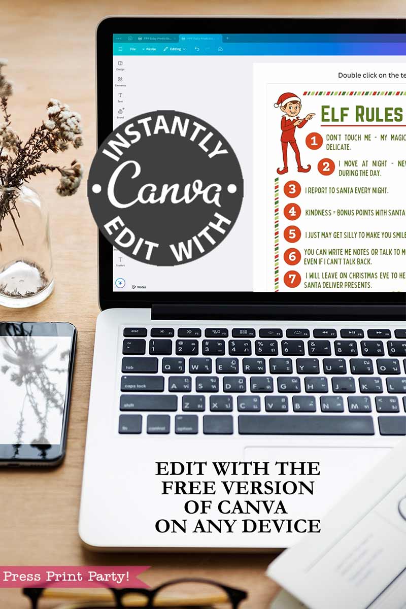 A laptop displays the Elf on the Shelf Movie Night Printable Kit open in Canva, with text saying “Instantly edit with Canva” and “Edit with the free version of Canva on any device.” A mouse, camera, and mug are nearby.