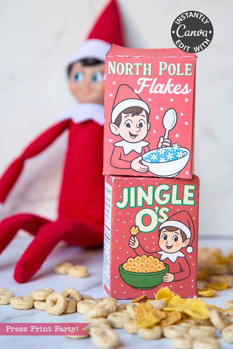 The Elf on the Shelf Breakfast Cereal Printable Kit features "North Pole Flakes" and "Jingle O's" boxes with elf designs, displayed in front of an Elf on the Shelf doll with cereal pieces scattered around for a festive breakfast setup.