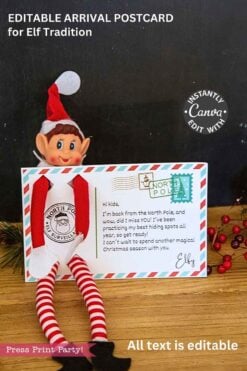 The Elf Arrival Postcard Printable features a plush Christmas elf in front of a festive postcard with a North Pole stamp, “Elf Surveillance” badge, and kid-friendly note, surrounded by holiday decorations and berries.