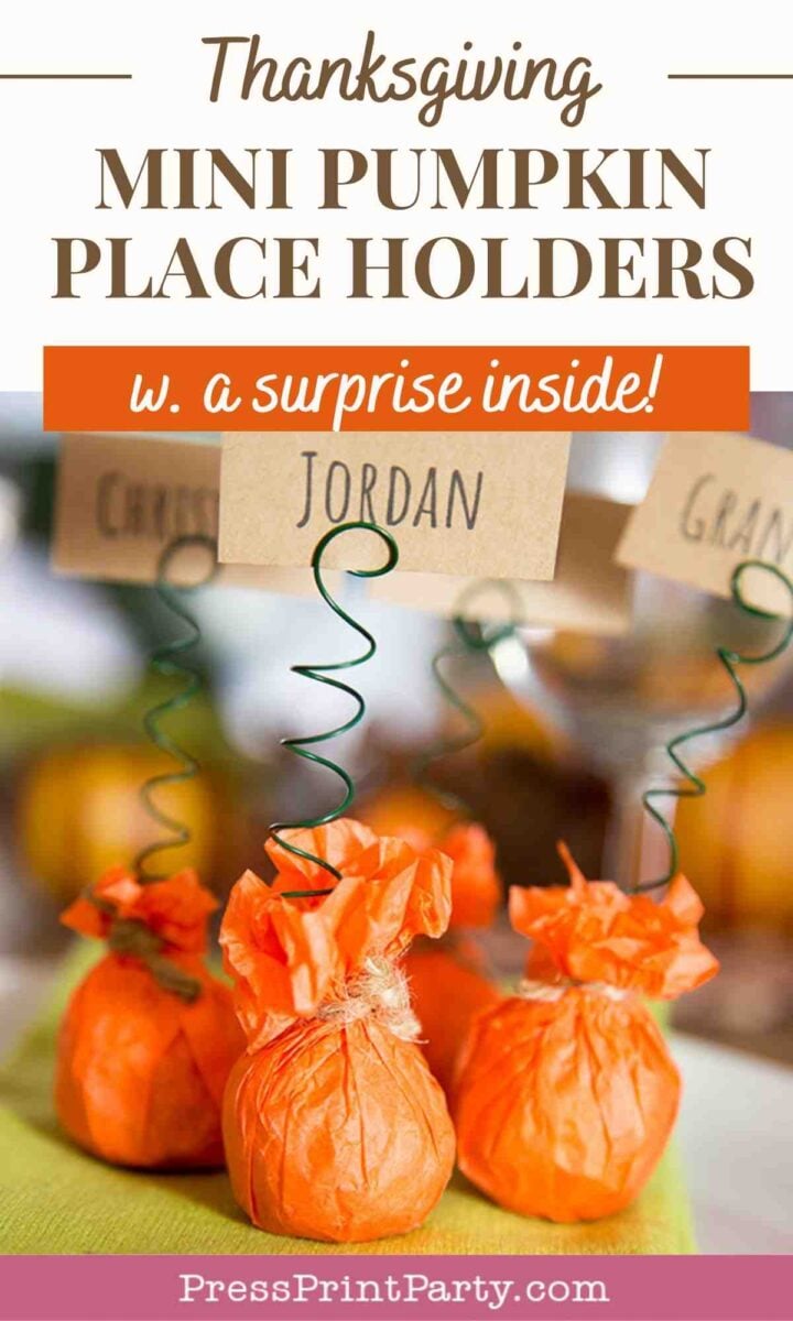 A group of orange pumpkins with green springs attached to them, resembling the vibrant look of mini pumpkin place card holders for thanksgiving