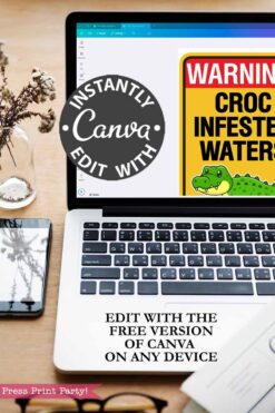 A laptop shows Canva with a Christmas Elf Croc Warning Sign Bathtub Prank cartoon. Text says, βInstantly edit with Canvaβ and βEdit with the free version of Canva on any device.β A notepad, pen, and flower are nearby.