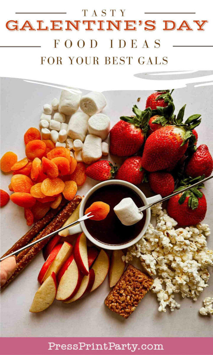 A plate with strawberries, marshmallows, dried apricots, apple slices, pretzel rods, popcorn, a granola bar, and a bowl of chocolate dip, arranged as Galentine’s Day food ideas for friends.