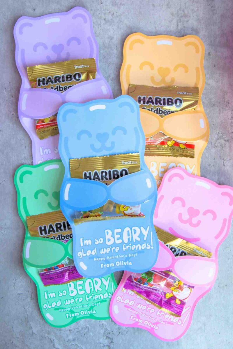 Five bear-shaped cards in pastel colors each hold a small Haribo Goldbears candy pack. The front blue and pink cards say, "I'm so BEARY glad we're friends! Happy Valentine's Day! From Olivia.