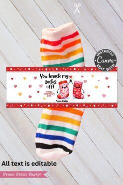 A Valentines Day Socks Wrap Printable featuring rainbow-striped socks and a gift tag with “You knock my socks off!” above cute sock illustrations, plus an editable Canva label—perfect for gifting on Valentine’s Day.