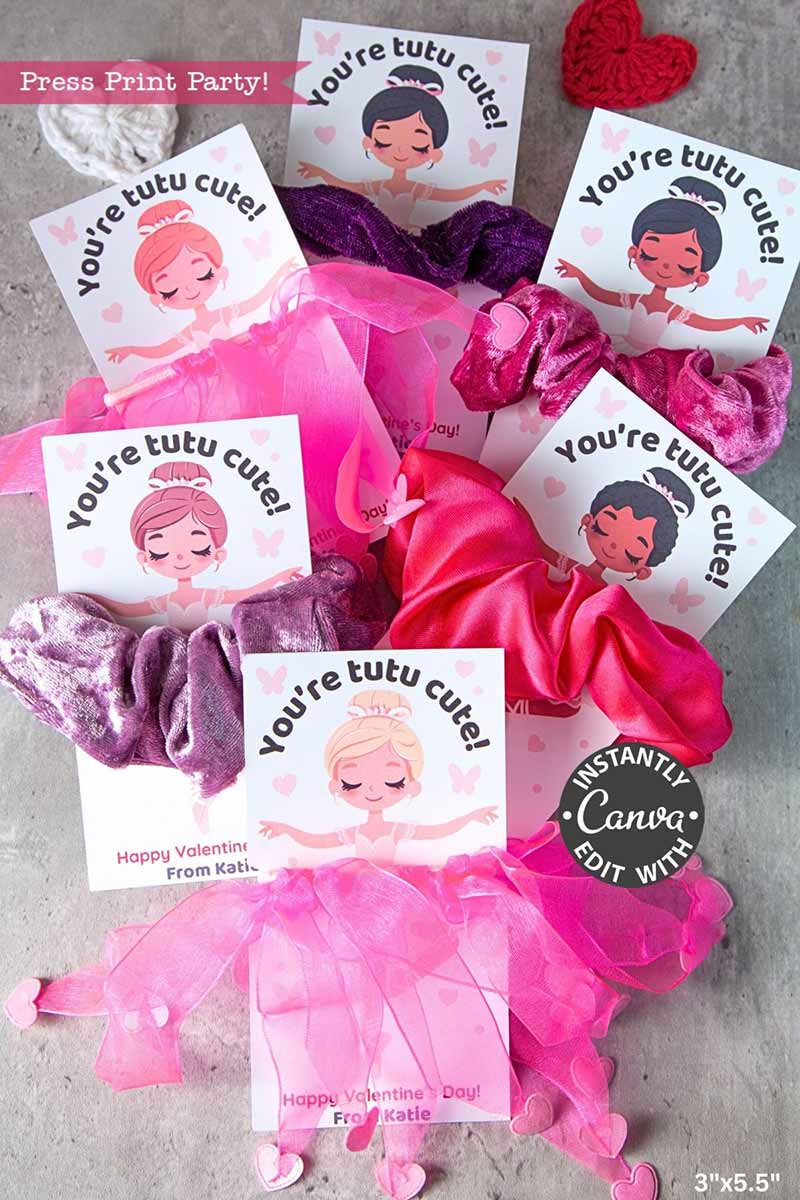 Ballerina Valentine Cards for Hair Scrunchie feature pink and purple scrunchies or tutu hair accessories attached to cards that say “You’re tutu cute!” Each card has an illustrated girl in a tutu on a gray background.