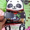 A hand holds a Panda Party Favors Treat Holder - Valentine & Party, containing chocolates and cute Valentine’s Day socks. The card says, “Happy Valentine’s Day! Panda hugs for you! From Olivia.” All text is editable in Canva.