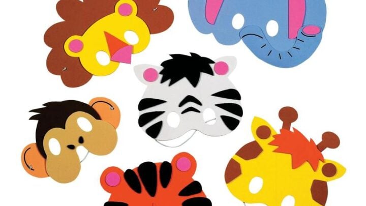Six colorful animal face masks made of foam or paper, representing a lion, elephant, monkey, zebra, tiger, and giraffe, each with eye holes and distinct features on a white background.