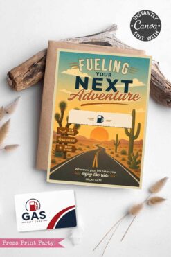 The Gas Gift Card Holder Printable - Mountain features a greeting card with a desert road, cacti, mountains, and a sunset reading “Fueling Your Next Adventure,” perfect for gifting alongside twigs, an envelope, and a pen.
