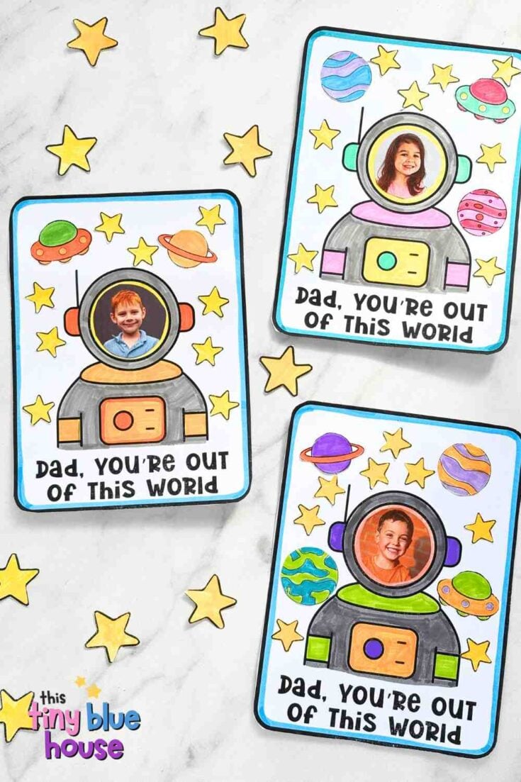 Three colorful cards featuring children's photos in astronaut suits, surrounded by stars and planets, with the message "Dad, you're out of this world" on each card. Extra yellow stars are scattered around the cards.