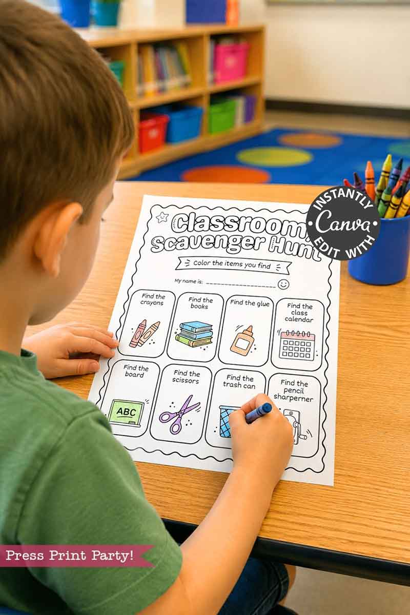 A young boy sits at a desk coloring a "Classroom Scavenger Hunt" worksheet created with the template Canva (Copy) (Copy), with crayons. Classroom shelves and a rug are visible in the background.