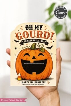 A hand holds one of the β7 Vintage Halloween Gift Card Holders,β showcasing a card with a smiling jack-oβ-lantern, bats, candy corn, and the message βOh My Gourd! You Deserve a Treat! Happy Halloween!ββa perfect design for presenting gift cards this Halloweenβset against a softly blurred indoor background.