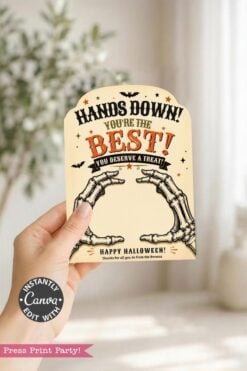 A hand displays one of the 7 Vintage Halloween Gift Card Holders, featuring skeleton hands, playful bats, and the message: “Hands Down! You’re the Best! You deserve a treat. Happy Halloween!”—perfect for presenting gift cards this spooky season.