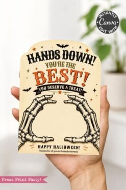 A hand holds one of the 7 Vintage Halloween Gift Card Holders, featuring skeleton hands and the message: βHands Down! Youβre the Best! You Deserve a Treat! Happy Halloween!β Decorative bats and festive colors make these holders a perfect choice for presenting gift cards this Halloween.