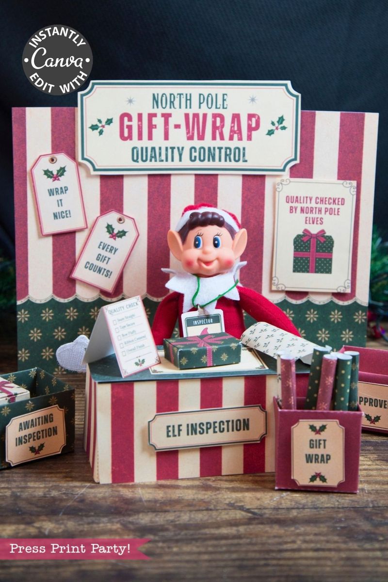 An elf doll sits at a festive “North Pole Gift-Wrap Quality Control” station decorated with striped accents, gift boxes, and inspection signs. The Christmas scene features red, green, and cream tones with a whimsical twist—a set of 6 Pink Coquette Halloween Ghost Round Labels peeks out playfully among the holiday trimmings.