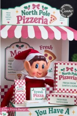 A cheerful elf doll stands inside a festive North Pole Pizzeria booth with pizza boxes, a menu, and a “Fresh Pizza Here!” sign, all decorated in red, white, and green holiday colors—complete with 6 Pink Coquette Halloween Ghost Round Labels for a playful seasonal twist.