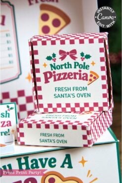 Two small pizza boxes with red and white checkered patterns say “North Pole Pizzeria: Fresh from Santa’s Oven.” Alongside festive holiday designs and playful pizza slice graphics, you’ll also spot charming 6 Pink Coquette Halloween Ghost Round Labels that add a whimsical twist to the packaging.