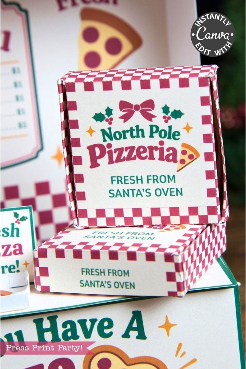 Two small pizza boxes with red and white checkered patterns say “North Pole Pizzeria: Fresh from Santa’s Oven.” Alongside festive holiday designs and playful pizza slice graphics, you’ll also spot charming 6 Pink Coquette Halloween Ghost Round Labels that add a whimsical twist to the packaging.