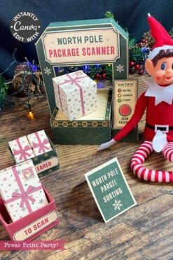 A festive scene featuring a North Pole package scanner display, a wrapped gift decorated with 6 Pink Coquette Halloween Ghost Round Labels, a sorting sign, boxes labeled “TO SCAN” and “CLEARED,” and a playful elf doll nestled among holiday decorations.
