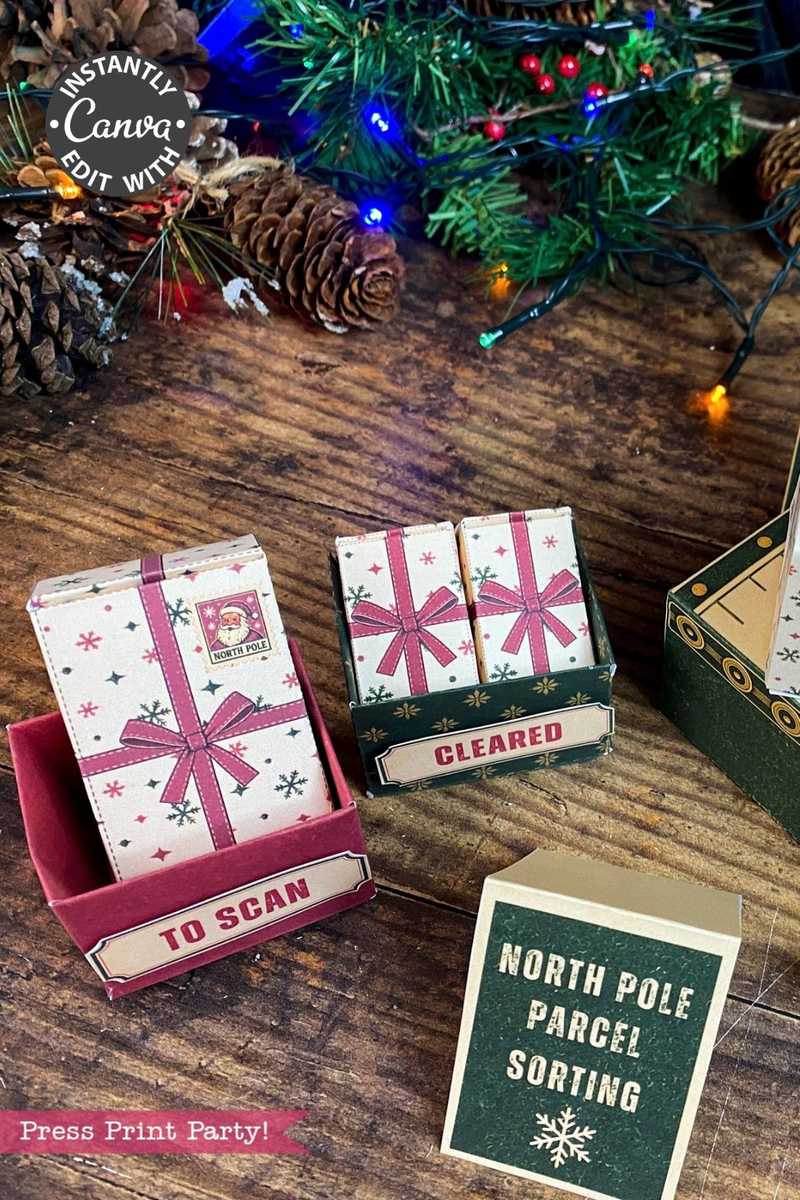 Christmas-themed paper boxes labeled “TO SCAN,” “CLEARED,” and “NORTH POLE PARCEL SORTING” are accented with 6 Pink Coquette Halloween Ghost Round Labels, and sit on a wooden table near a decorated Christmas tree and pinecones.