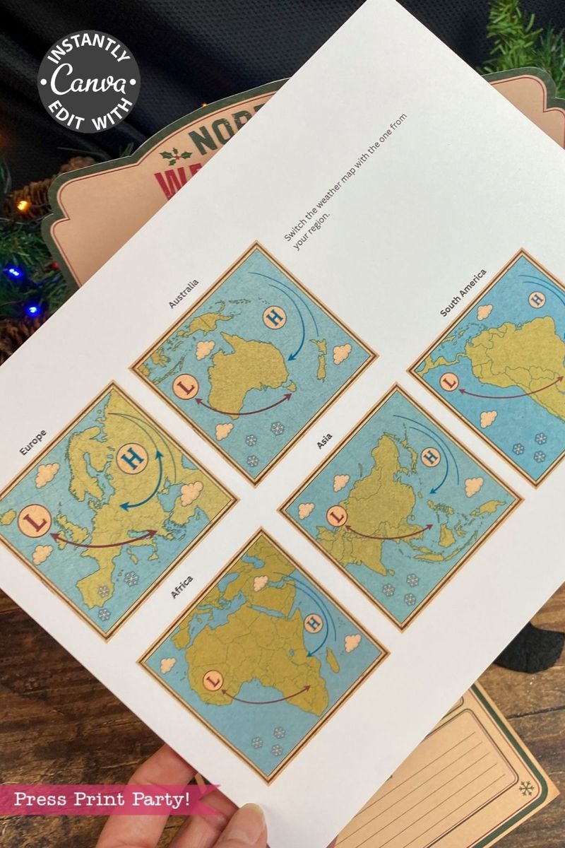 A hand holds a worksheet showing five illustrated world maps labeled by continent, each with “H” and “L” weather symbols styled like the 6 Pink Coquette Halloween Ghost Round Labels, positioned over a clipboard and near a decorated Christmas tree.