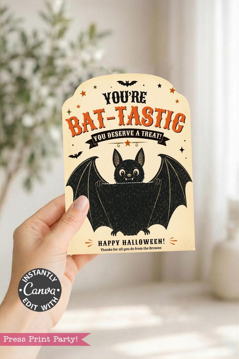 A hand holds one of the 7 Vintage Halloween Gift Card Holders, decorated with a cheerful bat, stars, and additional bats. This card is perfect for gifting at Halloween and reads: “You’re BAT-TASTIC. You deserve a treat! Happy Halloween! Thanks for all you do from the Browns.”.