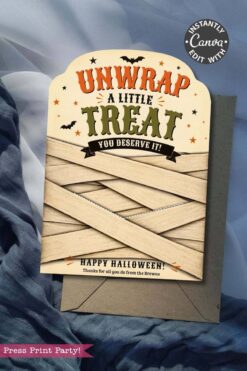 A set of 7 Vintage Halloween Gift Card Holders featuring bold “Unwrap a little treat, you deserve it!” text, decorated with bats and stars and designed to look like mummies—perfect for presenting gift cards this Halloween. Each holder includes a dark gray envelope and is photographed on draped blue fabric.