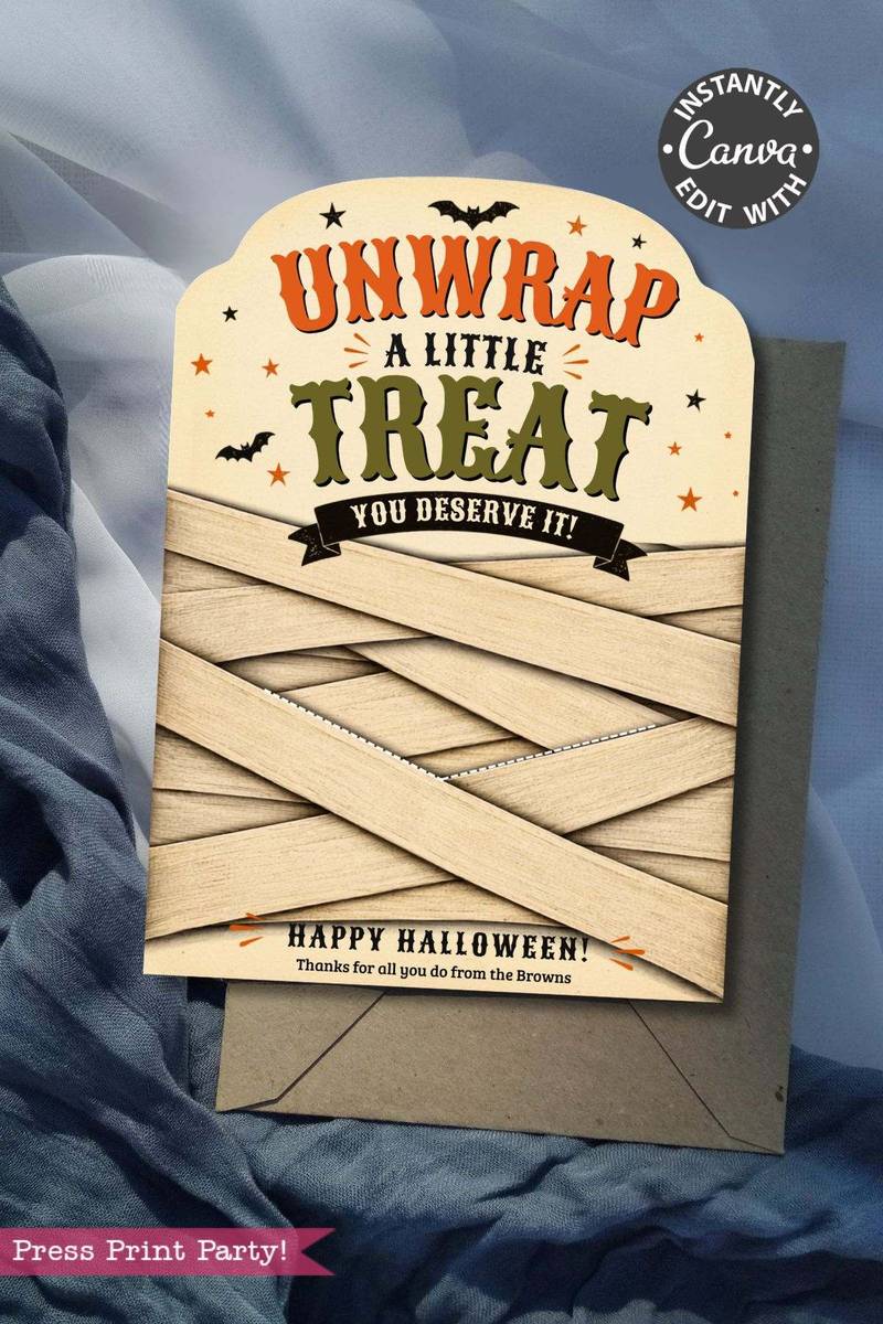 A set of 7 Vintage Halloween Gift Card Holders featuring bold “Unwrap a little treat, you deserve it!” text, decorated with bats and stars and designed to look like mummies—perfect for presenting gift cards this Halloween. Each holder includes a dark gray envelope and is photographed on draped blue fabric.