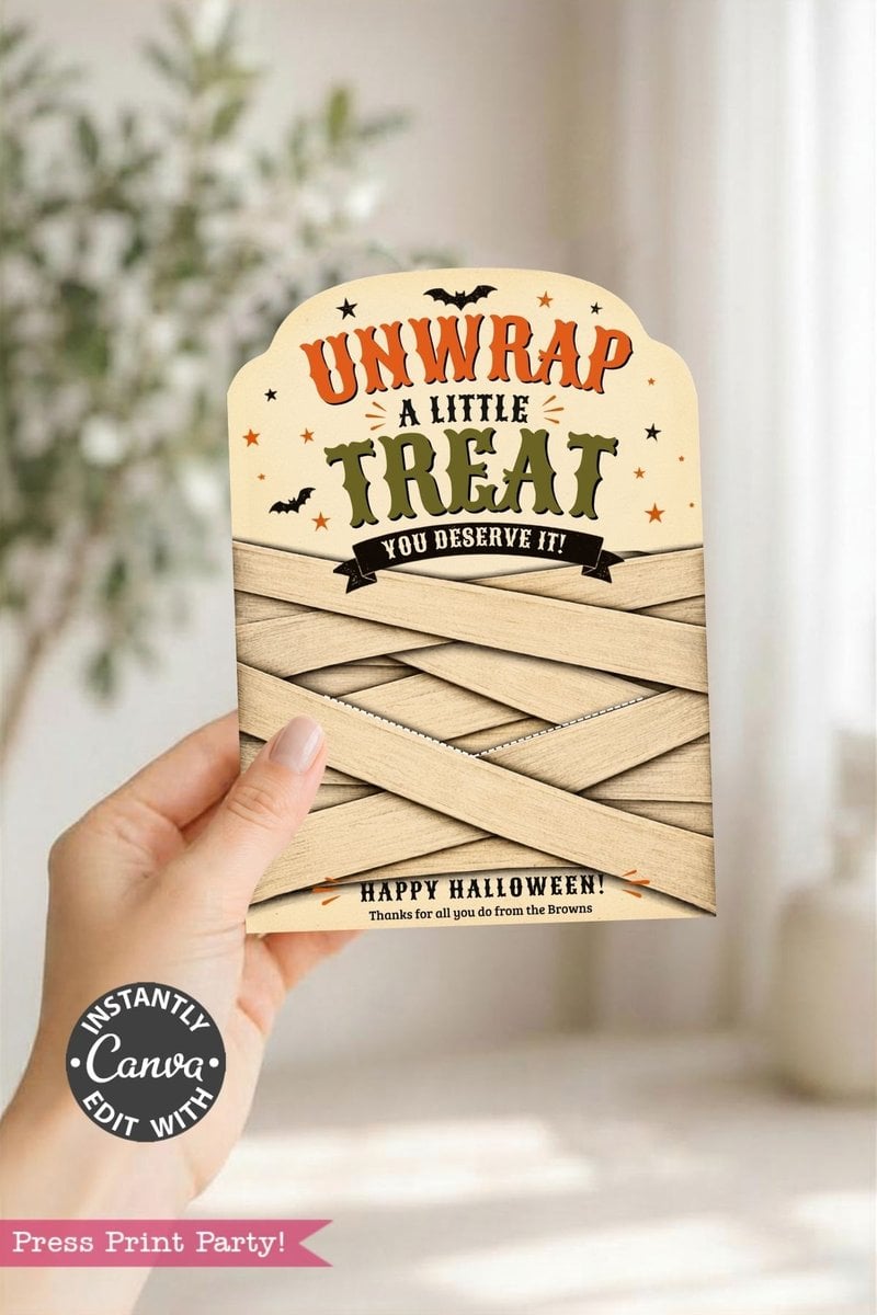 A hand holds a Halloween card reading “Unwrap a little treat you deserve it! Happy Halloween! Thanks for all you do from the Browns,” featuring a mummy design and bats—an ideal way to present your favorite gift using the 7 Vintage Halloween Gift Card Holders.
