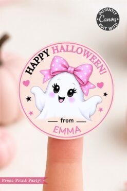 A cute ghost with a pink polka-dot bow and smiling face on a round label that says “Happy Halloween! from Emma.” The background is pink with stars and hearts.
