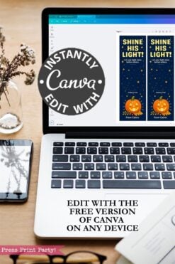 A laptop displays a Canva design for bookmarks with pumpkins and stars. Text on image promotes Canva editing, stating, “Edit with the free version of Canva on any device.” Nearby is a phone and a vase.