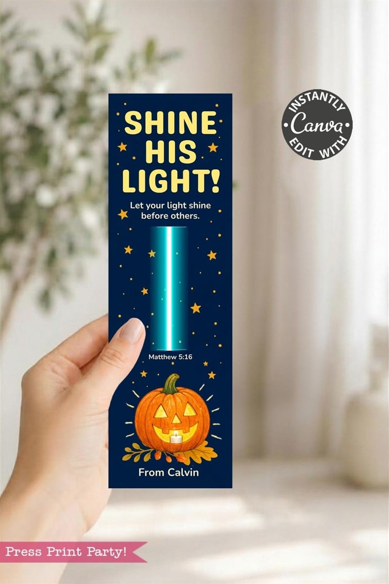 A hand holds a bookmark with a pumpkin, stars, and the text “SHINE HIS LIGHT!” plus a Bible verse; it reads “From Calvin” at the bottom.
