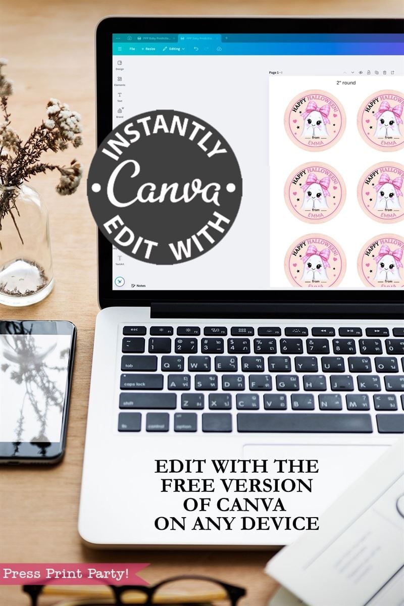 A laptop on a desk displays the “6 Pink Coquette Halloween Ghost Round Labels” being edited in Canva, along with dog stickers. A phone, a glass vase with flowers, and text promoting Canva’s free editing feature are also visible.