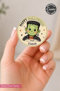 A hand holds a round Pink Coquette Ghost Treat Bag Halloween Sticker, featuring adorable cartoon artwork, colorful stars, and subtle pink coquette touches—perfect for adding cute, festive charm to your Halloween treats.