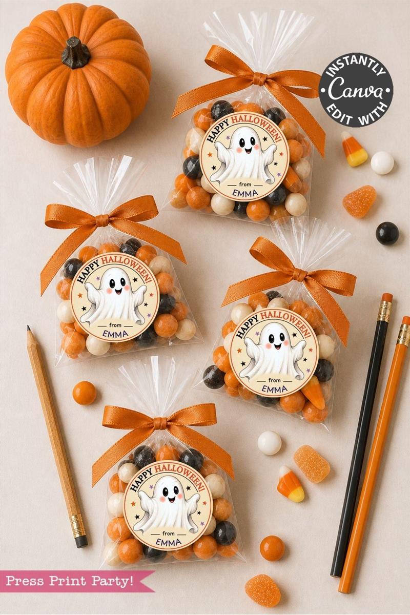 Four clear treat bags with “Happy Halloween” ghost tags and orange ribbons, surrounded by candy, pencils, a pumpkin, an eraser, and Pink Coquette Ghost Treat Bag Halloween Stickers on a beige surface.