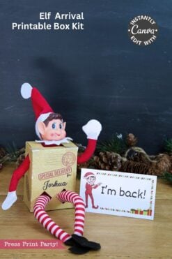 A toy elf from the Elf Arrival Printable Bundle sits in a small cardboard box addressed to βJoshuaβ next to an elf arrival printable sign that says βIβm back!β.