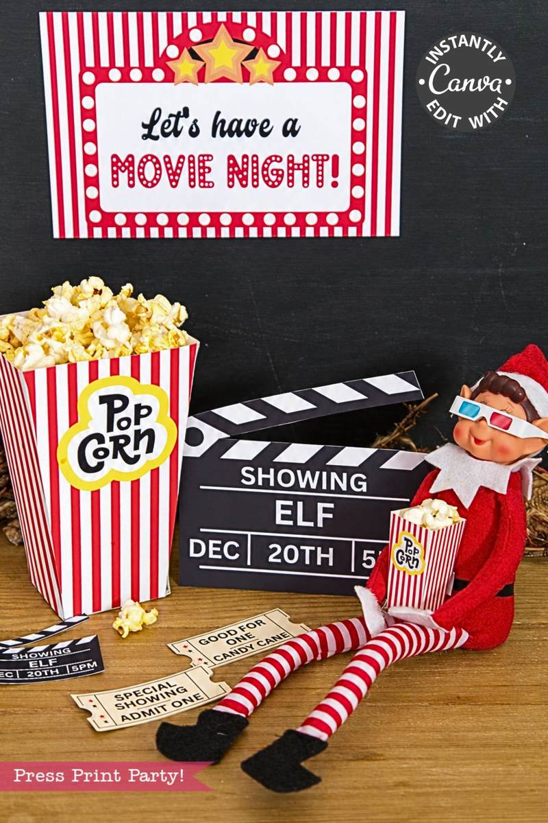 A toy elf wearing 3D glasses sits next to popcorn, a clapperboard, and printable movie tickets from the Elf Arrival Printable Bundle, Christmas Elf Kit under a “Let’s have a MOVIE NIGHT!” sign for this elf arrival scene.