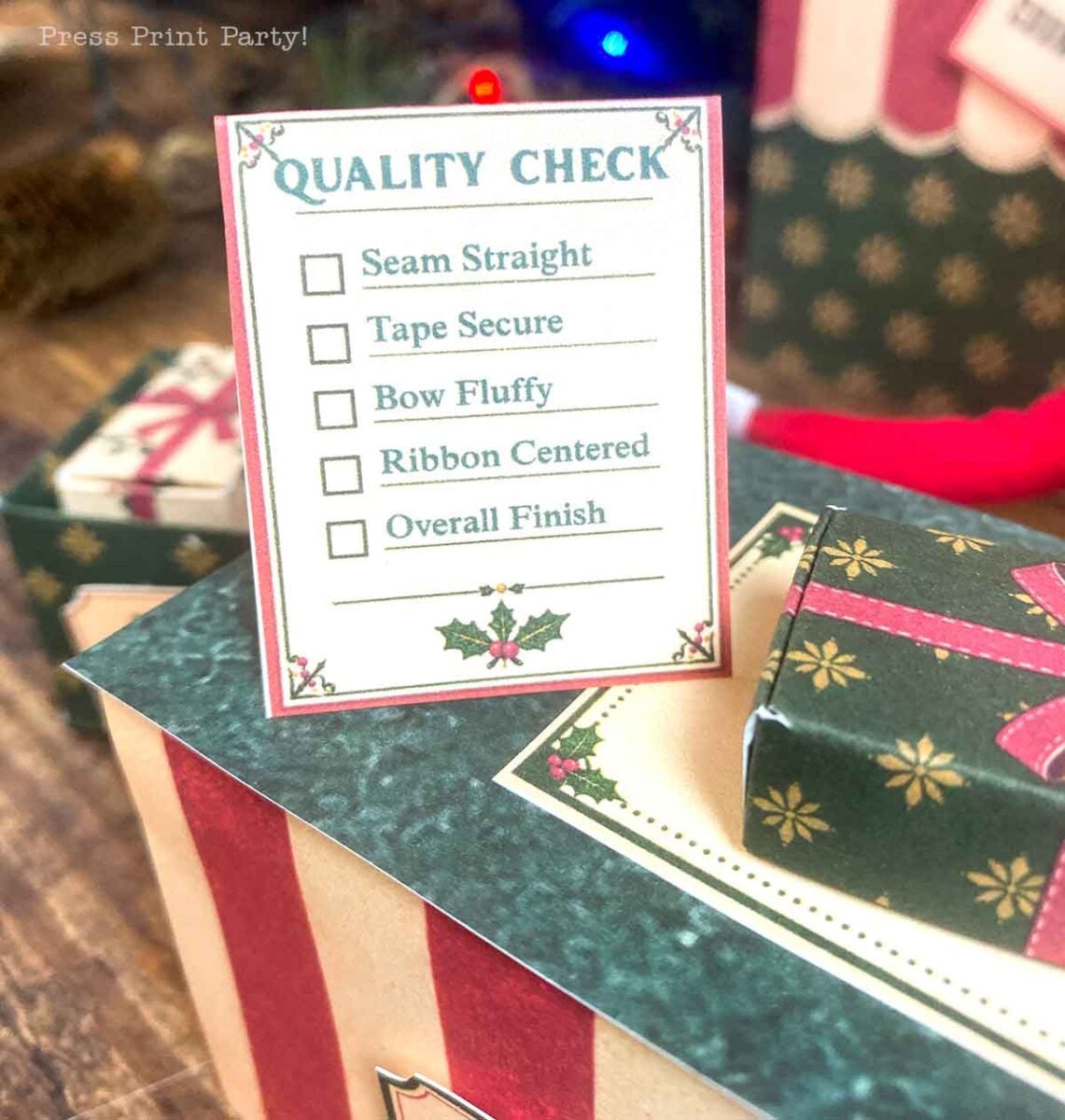 A Quality Check card with checkboxes for Seam Straight, Tape Secure, Bow Fluffy, Ribbon Centered, and Overall Finish, resting on a miniature gift box.