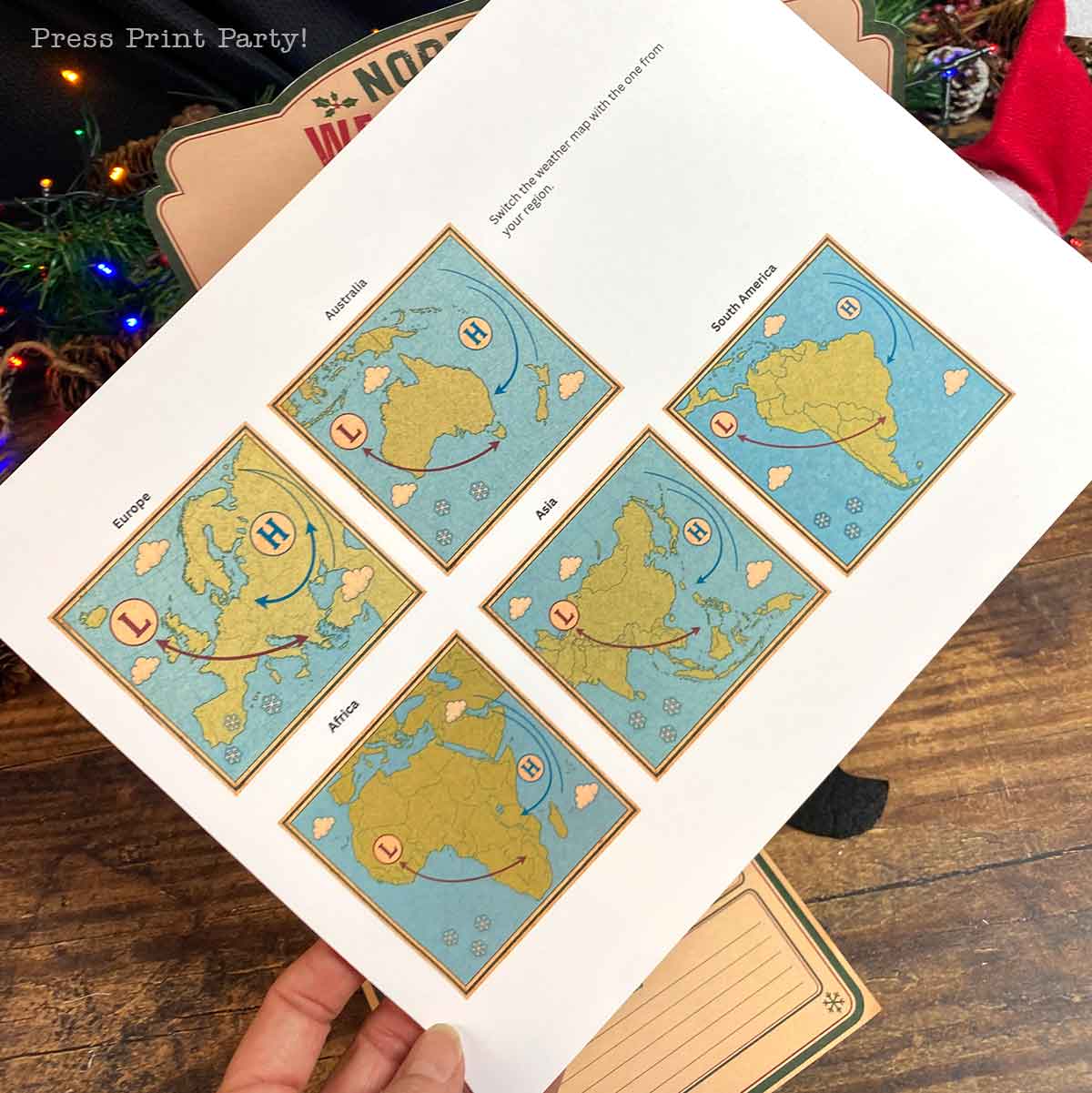 A printed worksheet showing five separate weather maps for different continents, each labeled with high and low-pressure systems and wind direction arrows.
