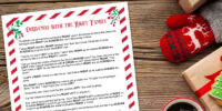 The left right game christmas story printed on paper on a wood table