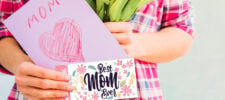 110 mother's day coupon ideas. mom holding a card and coupon book. Press Print Party!