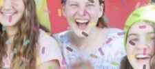 Three smiling girls are partially visible, standing together with colorful confetti-like sprinkles overlaying the image—a perfect snapshot for anyone searching for teen birthday party ideas. The background has red and yellow tones, while the words “Press Print Party!” appear in the lower right corner.