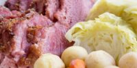 oven roasted corned beef and steamed cabbage on a plate with potatoes and carrots- baking oven cooked -. Press Print Party!
