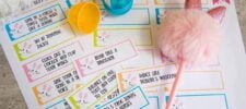 A collection of vibrant Easter-themed activity cards perfect for an Easter egg hunt. Each card features playful tasks like "Roar like a dinosaur" or "Spin in a circle five times." A fluffy pen with pink bunny ears and an open plastic egg accompany the set, inviting endless fun.
